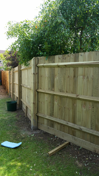 Six foot high featheredge fence during install.