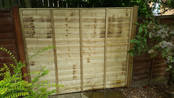 A brand new fence panel installed.